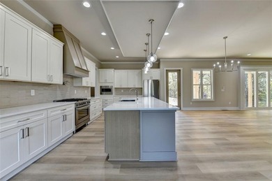 Step into refined luxury at 2881 Traditions Way in the on Traditions of Braselton Golf Club in Georgia - for sale on GolfHomes.com, golf home, golf lot