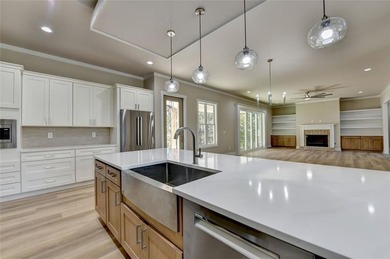 Step into refined luxury at 2881 Traditions Way in the on Traditions of Braselton Golf Club in Georgia - for sale on GolfHomes.com, golf home, golf lot