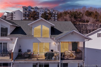 Experience lake living in this 4-bedroom, 2-bath penthouse on The Club At Old Kinderhook in Missouri - for sale on GolfHomes.com, golf home, golf lot