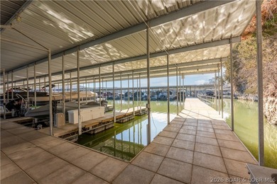 Experience lake living in this 4-bedroom, 2-bath penthouse on The Club At Old Kinderhook in Missouri - for sale on GolfHomes.com, golf home, golf lot