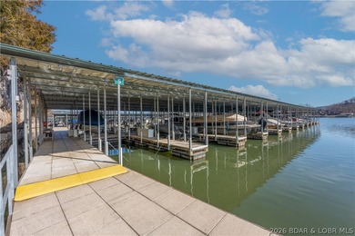 Experience lake living in this 4-bedroom, 2-bath penthouse on The Club At Old Kinderhook in Missouri - for sale on GolfHomes.com, golf home, golf lot