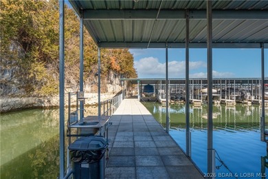 Experience lake living in this 4-bedroom, 2-bath penthouse on The Club At Old Kinderhook in Missouri - for sale on GolfHomes.com, golf home, golf lot