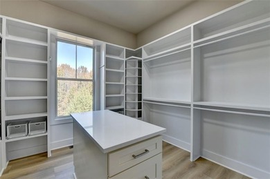 Step into refined luxury at 2881 Traditions Way in the on Traditions of Braselton Golf Club in Georgia - for sale on GolfHomes.com, golf home, golf lot