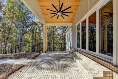 Step into refined luxury at 2881 Traditions Way in the on Traditions of Braselton Golf Club in Georgia - for sale on GolfHomes.com, golf home, golf lot