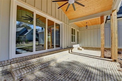 Step into refined luxury at 2881 Traditions Way in the on Traditions of Braselton Golf Club in Georgia - for sale on GolfHomes.com, golf home, golf lot