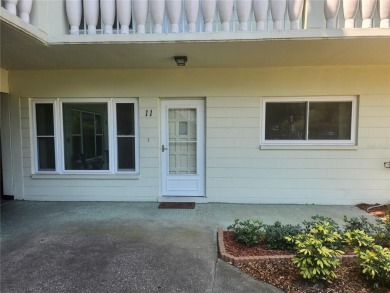 GROUND FLOOR 2 bedroom/2 bath condo on WEST side of Belcher that on On Top Of The World Golf Course in Florida - for sale on GolfHomes.com, golf home, golf lot