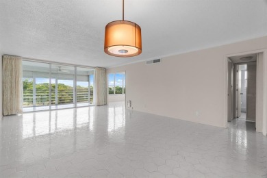 This spacious 5th-floor, 3 Beds, 2 Baths, condo offers 1,500 on Palm-Aire Country Club and Resort - Palms in Florida - for sale on GolfHomes.com, golf home, golf lot