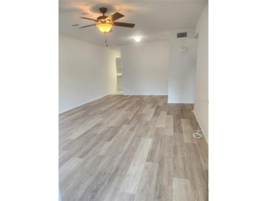 GROUND FLOOR 2 bedroom/2 bath condo on WEST side of Belcher that on On Top Of The World Golf Course in Florida - for sale on GolfHomes.com, golf home, golf lot