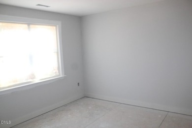 Experience the ultimate resort lifestyle in this move-in ready on River Golf and Country Club at Lake Royale in North Carolina - for sale on GolfHomes.com, golf home, golf lot