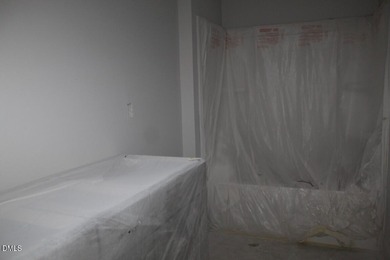 Experience the ultimate resort lifestyle in this move-in ready on River Golf and Country Club at Lake Royale in North Carolina - for sale on GolfHomes.com, golf home, golf lot