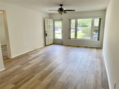 GROUND FLOOR 2 bedroom/2 bath condo on WEST side of Belcher that on On Top Of The World Golf Course in Florida - for sale on GolfHomes.com, golf home, golf lot
