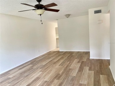 GROUND FLOOR 2 bedroom/2 bath condo on WEST side of Belcher that on On Top Of The World Golf Course in Florida - for sale on GolfHomes.com, golf home, golf lot