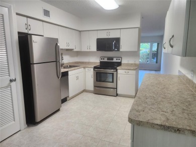 GROUND FLOOR 2 bedroom/2 bath condo on WEST side of Belcher that on On Top Of The World Golf Course in Florida - for sale on GolfHomes.com, golf home, golf lot