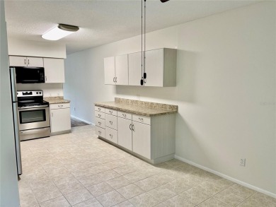 GROUND FLOOR 2 bedroom/2 bath condo on WEST side of Belcher that on On Top Of The World Golf Course in Florida - for sale on GolfHomes.com, golf home, golf lot