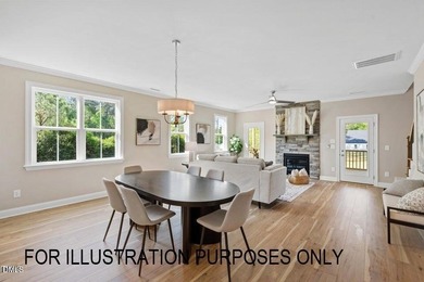 Experience the ultimate resort lifestyle in this move-in ready on River Golf and Country Club at Lake Royale in North Carolina - for sale on GolfHomes.com, golf home, golf lot