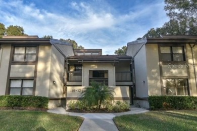 Come home every evening, relax on your screen enclosed oversized on East Lake Woodlands Country Club in Florida - for sale on GolfHomes.com, golf home, golf lot