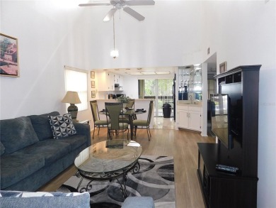 Come home every evening, relax on your screen enclosed oversized on East Lake Woodlands Country Club in Florida - for sale on GolfHomes.com, golf home, golf lot