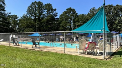 Experience the ultimate resort lifestyle in this move-in ready on River Golf and Country Club at Lake Royale in North Carolina - for sale on GolfHomes.com, golf home, golf lot