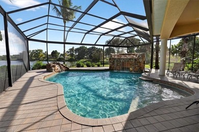 Lakefront and beautifully crafted, this custom-built home sits on Imperial Golf Club in Florida - for sale on GolfHomes.com, golf home, golf lot
