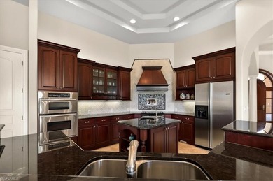 Lakefront and beautifully crafted, this custom-built home sits on Imperial Golf Club in Florida - for sale on GolfHomes.com, golf home, golf lot