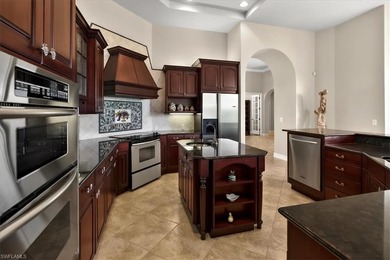 Lakefront and beautifully crafted, this custom-built home sits on Imperial Golf Club in Florida - for sale on GolfHomes.com, golf home, golf lot