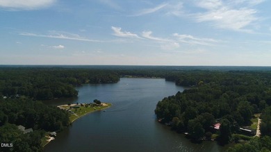 Experience the ultimate resort lifestyle in this move-in ready on River Golf and Country Club at Lake Royale in North Carolina - for sale on GolfHomes.com, golf home, golf lot