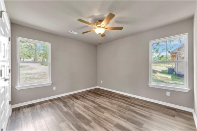 Welcome to this beautiful three-bedroom, two-bathroom new on Holiday Island Executive Golf Course in Arkansas - for sale on GolfHomes.com, golf home, golf lot