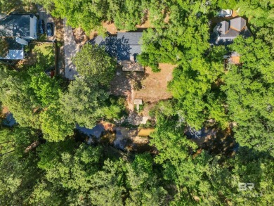 Experience exceptional Creekside living with this 4-bedroom, 2 on Lake Forest Yacht and Country Club in Alabama - for sale on GolfHomes.com, golf home, golf lot
