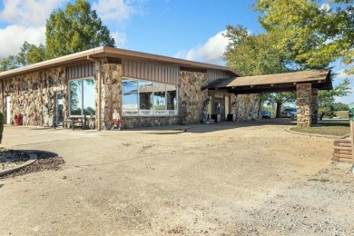 Located just 2 miles from Bull Shoals Lake in Diamond City on Diamond Hills Country Club in Arkansas - for sale on GolfHomes.com, golf home, golf lot