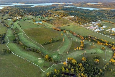 Located just 2 miles from Bull Shoals Lake in Diamond City on Diamond Hills Country Club in Arkansas - for sale on GolfHomes.com, golf home, golf lot