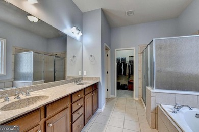 Rarely available primary-on-main floor bedroom plan in highly on Hampton Golf Village in Georgia - for sale on GolfHomes.com, golf home, golf lot