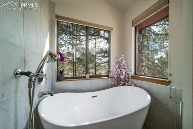 Custom RANCH-STYLE Home is with Finished Walkout Basement on on The Golf Club At Bear Dance in Colorado - for sale on GolfHomes.com, golf home, golf lot