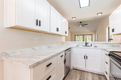 Welcome home to this beautifully updated 2-bedroom, 2-bath on Meadow Oaks Golf and Country Club in Florida - for sale on GolfHomes.com, golf home, golf lot