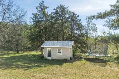 This bi-level home is located on a tranquil 1-acre lot at the on Mascoutin Country Club in Wisconsin - for sale on GolfHomes.com, golf home, golf lot