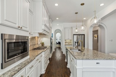 Step into luxury with this stunning one-story Highland-built on The Tribute At the Colony in Texas - for sale on GolfHomes.com, golf home, golf lot