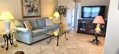 Furnished 1 bedroom-1.5 bath condo. 18* diagonal tile throughout on The American Golf Club in Florida - for sale on GolfHomes.com, golf home, golf lot