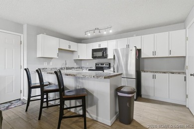 Imagine starting your day with coffee on your private deck as on Seasons Ridge At Four Seasons in Missouri - for sale on GolfHomes.com, golf home, golf lot