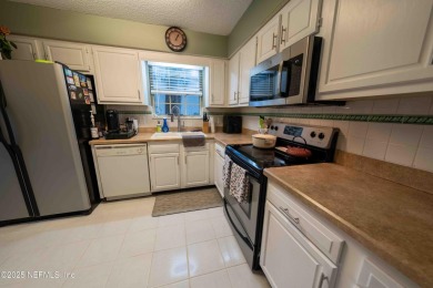 Fantastic pool home tucked away in a quiet Fort Caroline on Hidden Hills Country Club in Florida - for sale on GolfHomes.com, golf home, golf lot