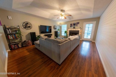 Fantastic pool home tucked away in a quiet Fort Caroline on Hidden Hills Country Club in Florida - for sale on GolfHomes.com, golf home, golf lot