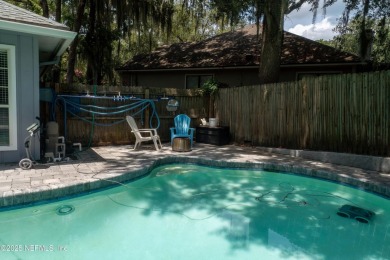 Fantastic pool home tucked away in a quiet Fort Caroline on Hidden Hills Country Club in Florida - for sale on GolfHomes.com, golf home, golf lot