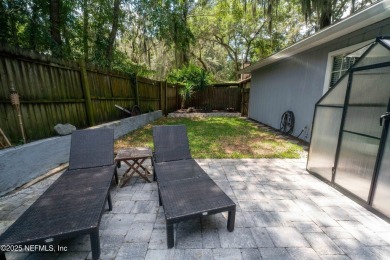 Fantastic pool home tucked away in a quiet Fort Caroline on Hidden Hills Country Club in Florida - for sale on GolfHomes.com, golf home, golf lot