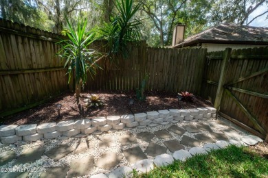 Fantastic pool home tucked away in a quiet Fort Caroline on Hidden Hills Country Club in Florida - for sale on GolfHomes.com, golf home, golf lot
