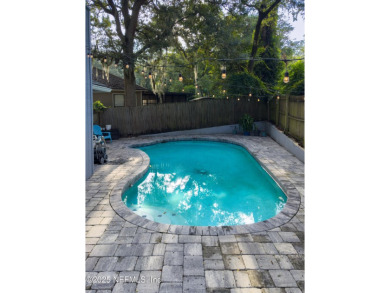 Fantastic pool home tucked away in a quiet Fort Caroline on Hidden Hills Country Club in Florida - for sale on GolfHomes.com, golf home, golf lot