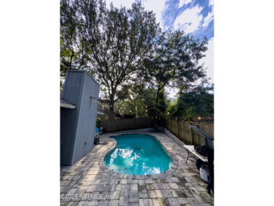 Fantastic pool home tucked away in a quiet Fort Caroline on Hidden Hills Country Club in Florida - for sale on GolfHomes.com, golf home, golf lot