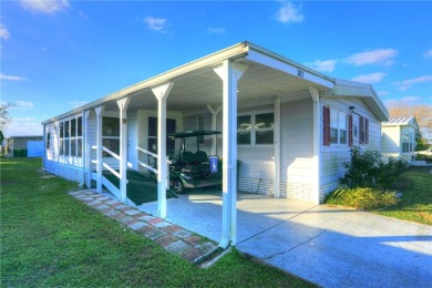 Turnkey 2/2 home in Barefoot Bay with stunning lake views! Enjoy on Barefoot Bay Golf Course in Florida - for sale on GolfHomes.com, golf home, golf lot