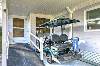 Turnkey 2/2 home in Barefoot Bay with stunning lake views! Enjoy on Barefoot Bay Golf Course in Florida - for sale on GolfHomes.com, golf home, golf lot