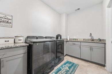 Discover luxury coastal living in this 5-bedroom, 3.5-bath on Surf Golf and Beach Club in South Carolina - for sale on GolfHomes.com, golf home, golf lot