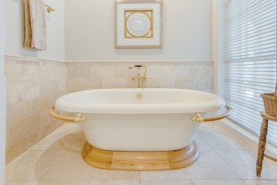 Timeless elegance on the bay behind the gates of prestigious on Regatta Bay Golf and Country Club in Florida - for sale on GolfHomes.com, golf home, golf lot