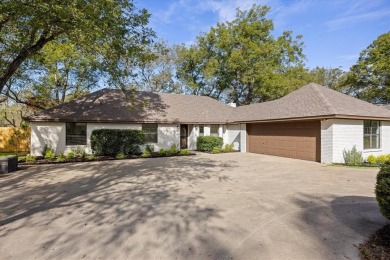 Welcome to this beautifully renovated home nestled in the heart on Pecan Plantation Country Club in Texas - for sale on GolfHomes.com, golf home, golf lot