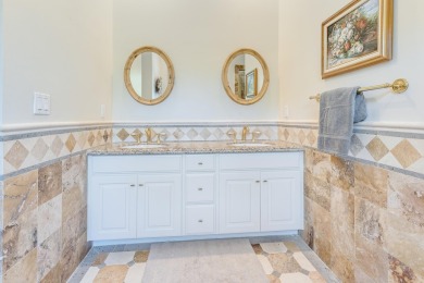 Timeless elegance on the bay behind the gates of prestigious on Regatta Bay Golf and Country Club in Florida - for sale on GolfHomes.com, golf home, golf lot
